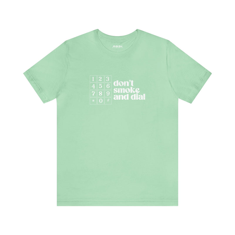 Green cotton t-shirt that says Don't smoke and Dial.