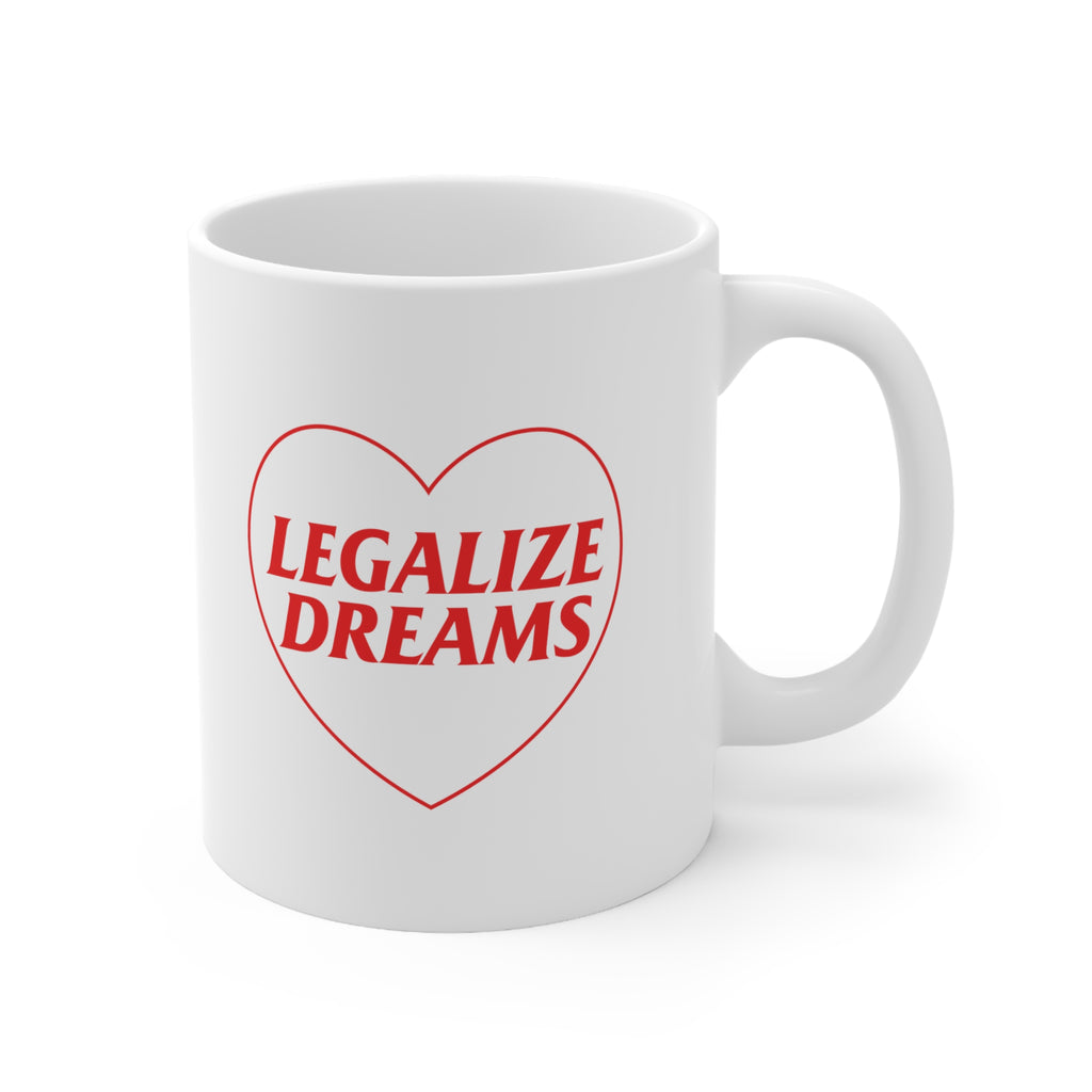 White ceramic coffee mug that has a red heart with Legalize Dreams written on it.