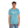 Male model wearing a Turquoise T-Shirt that says, Yeah, I'm Werid So What?