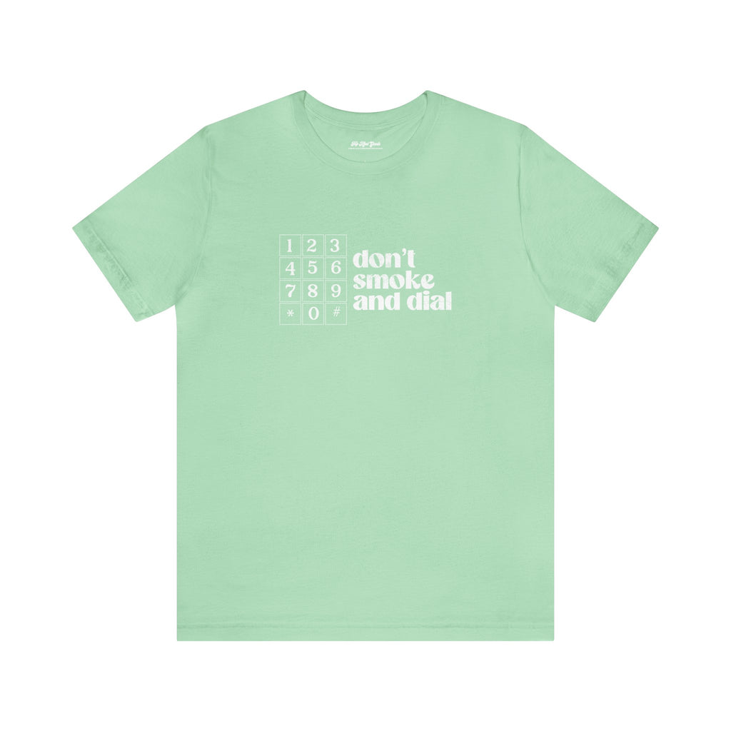 Green cotton t-shirt that says Don't smoke and Dial.