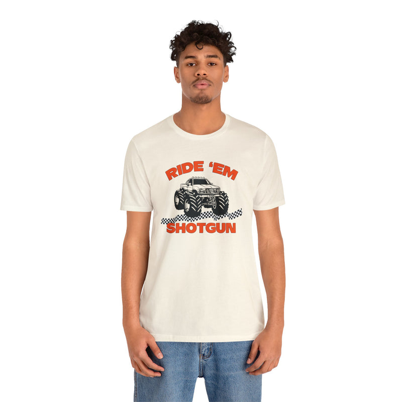 Male model wearing cream colored T-Shirt that says Ride Em Shotgun with Monster Truck on the front.