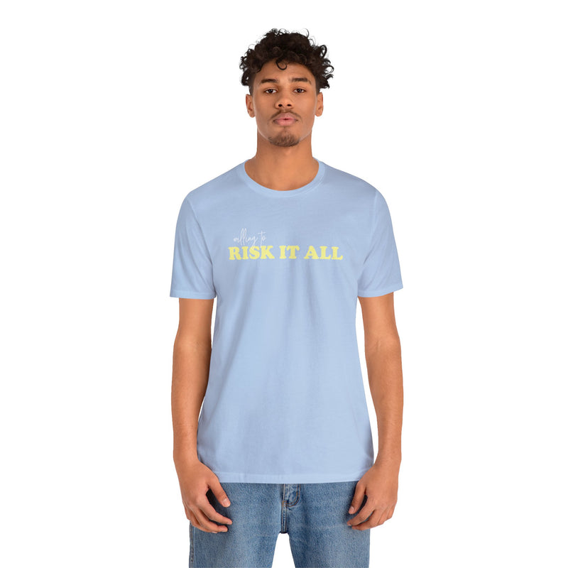Male Model wearing Blue T-Shirt that Says Willing To Risk It All. 