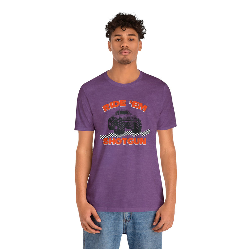Male model wearing purple colored T-Shirt with a monster Truck on it that says Ride Em Shotgun.
