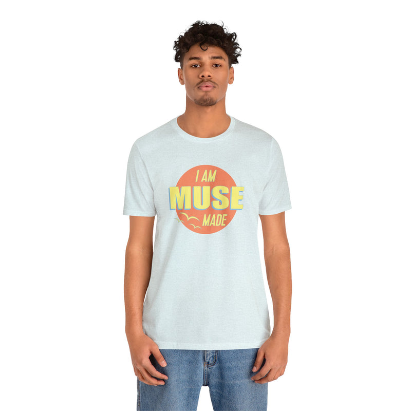 Male model wearing light blue 70s inspired T-Shirt that says I am Muse Made.