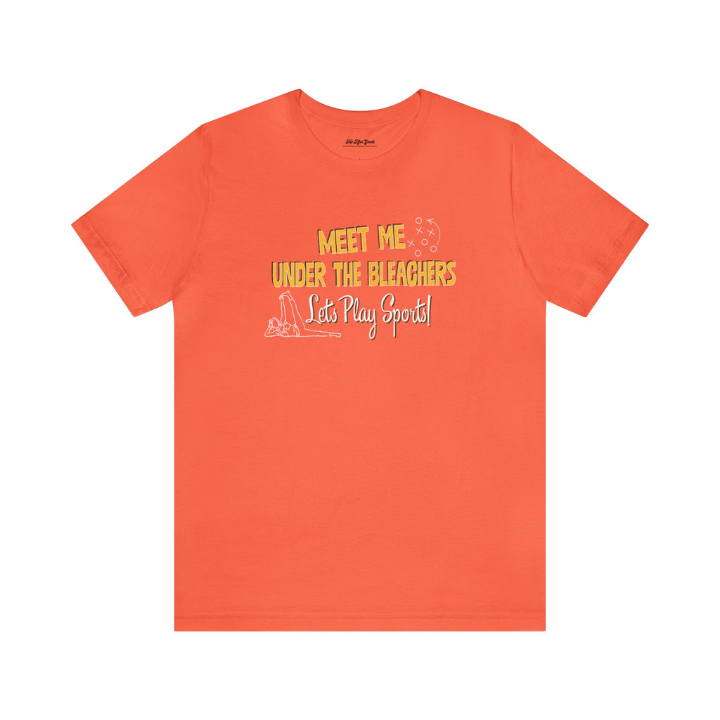 Orange cotton shirt by Top Knot Goods that says Meet Me Under The Bleachers, Lets Play Sports.