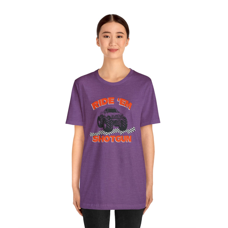 Female model wearing purple colored T-Shirt with a monster Truck on it that says Ride Em Shotgun