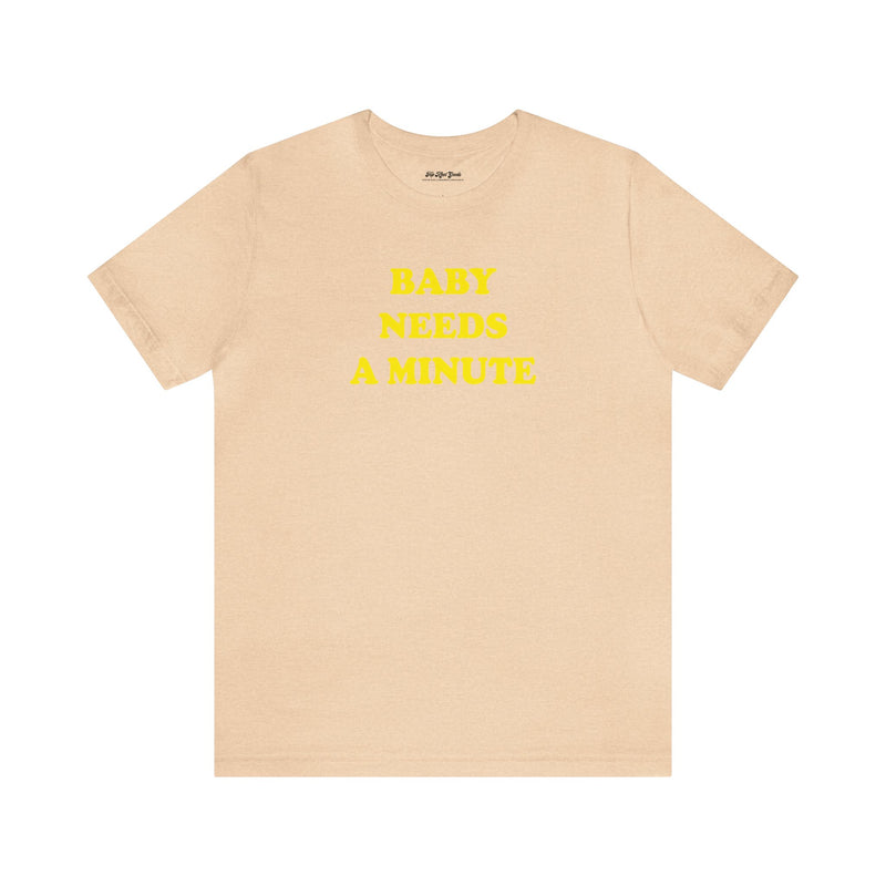 Top Knot Goods sand dune shirt that says "Baby Needs A Minute""