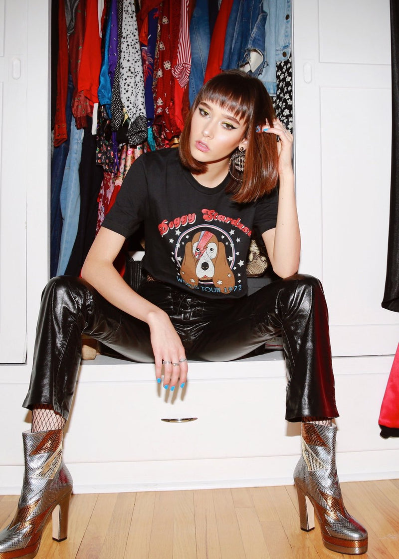 Top Knot Goods black cotton T-Shirt that says Doggy Stardust World Tour 1972 with black leather pants and silver boots