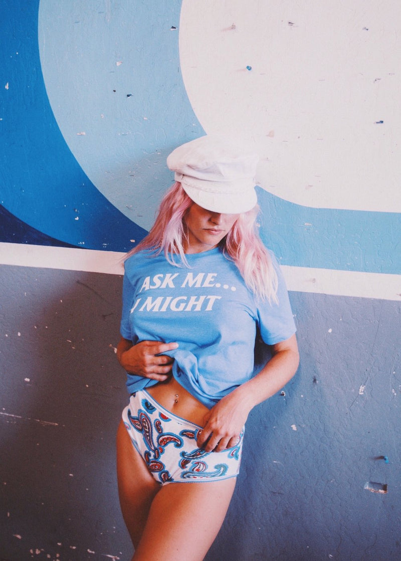 Girl wearing underwear and a vintage blue t-shirt