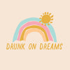 Art work that says Drunk on Dreams with a colorful rainbow and sun