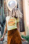 Girl shaking her hair wearing yellow Moon Swoon vintage inspired tee from Top Knot Goods